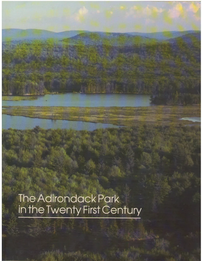 COver of book showing green mountains surrounding a lake