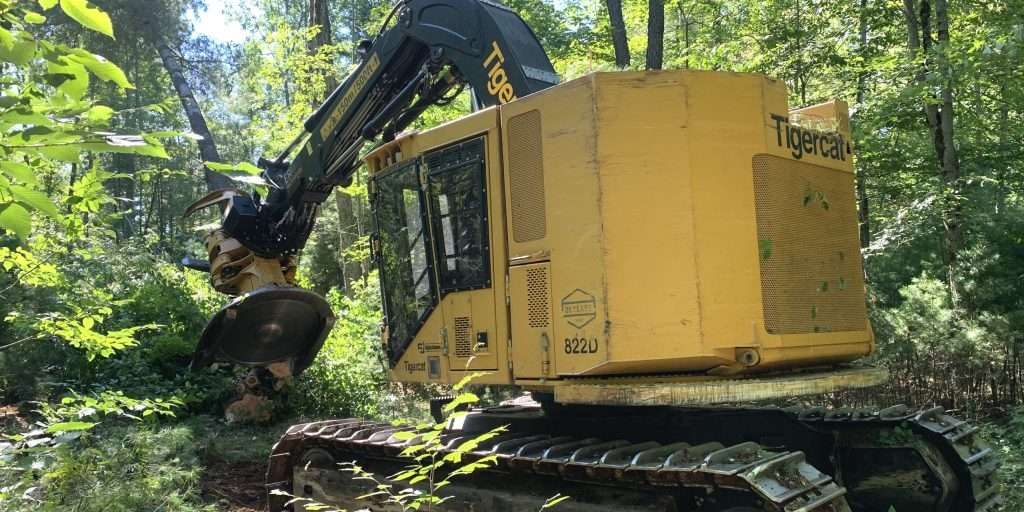 An Adirondack Tigercat 822E track feller buncher during logging operations